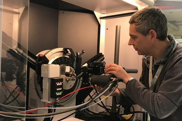 Professor Kenneth Shankland works with a large diagnostic computer